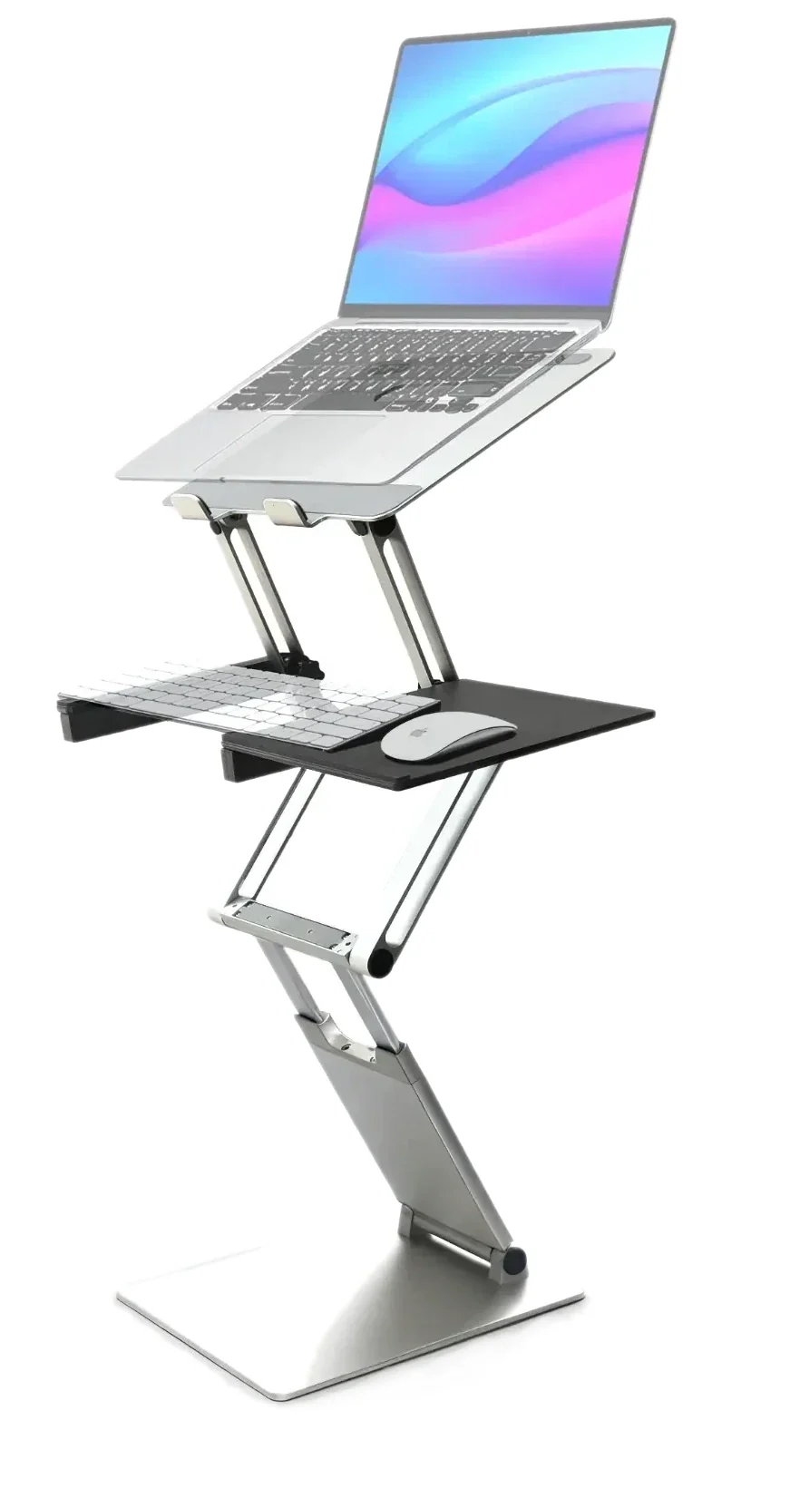 DriftDesk fully extended to standing height, holding a laptop with the ergonomic keyboard and mouse tray attached